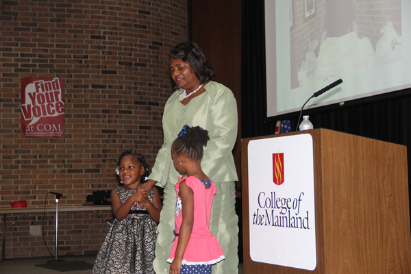 Tillie Henson speaks at the COM 2017 Juneteenth celebration with her granddaughters